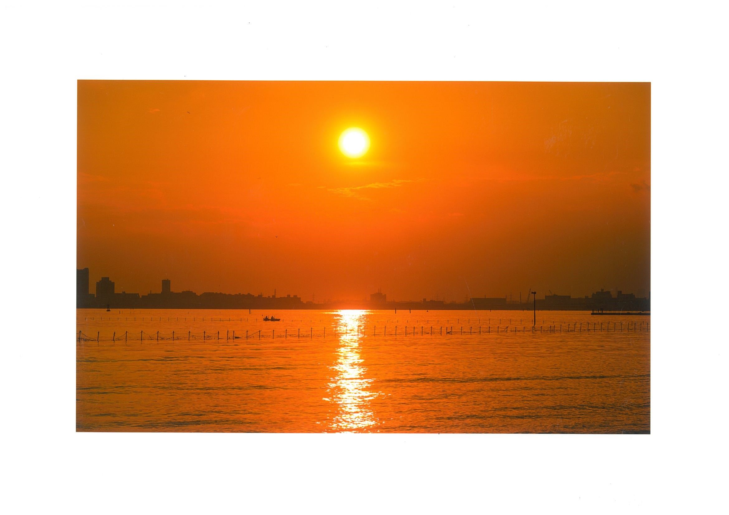秋夕焼けにパドル漕ぐ